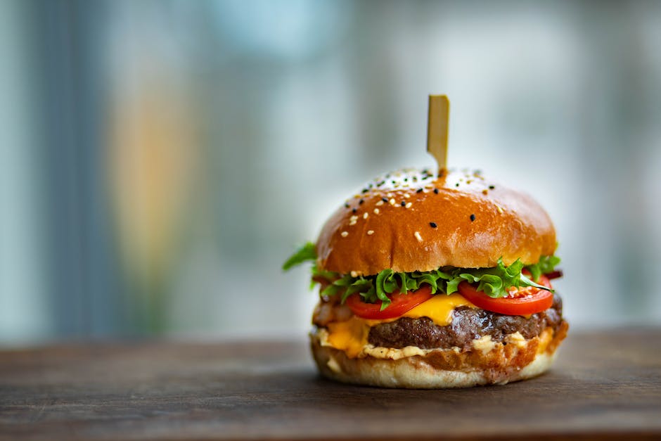 A delicious Crispy Onion Carne Burger placed on a table