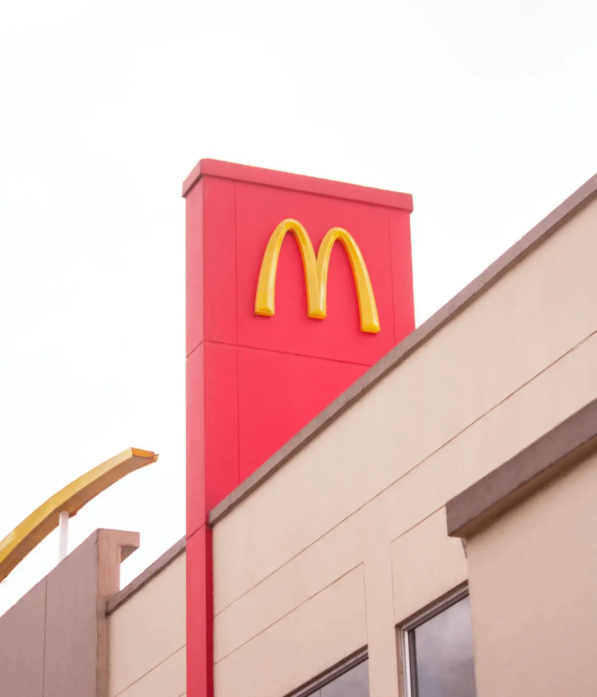 A colorful McDonald's logo on a white background with the words 'successful expansion' written in bold letters underneath the logo. The image represents McDonald's successful expansion in the South African market.